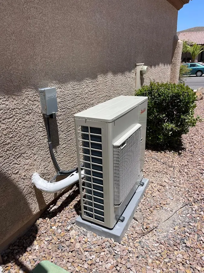 Residential air conditioning condenser unit in Elwood